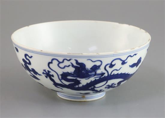 A Chinese blue and white dragon bowl, Qianlong seal mark and period (1736-95), D. 14.7cm, faults